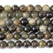 This is a Dakota Stones 10mm Green Garnet Gemstone strand with round beads in 15-16 inch strand.