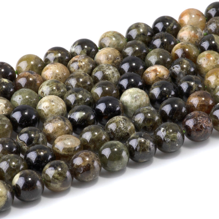 This is a Dakota Stones 10mm Green Garnet Gemstone strand with round beads in 15-16 inch strand.