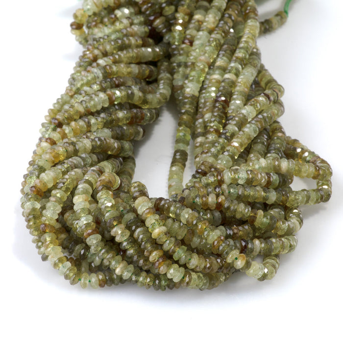 This is a Dakota Stones 2x4mm Green Garnet Gemstone strand with AAA grade faceted rondelle beads in 15-16 inch strand.