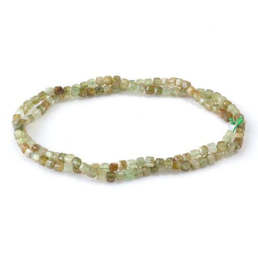This is a Dakota Stones 3mm Green Garnet Gemstone strand with table-cut faceted cube beads in 15-16 inch strand.