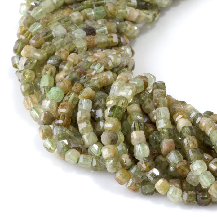 This is a Dakota Stones 3mm Green Garnet Gemstone strand with table-cut faceted cube beads in 15-16 inch strand.