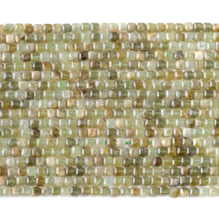 This is a Dakota Stones 3mm Green Garnet Gemstone strand with table-cut faceted cube beads in 15-16 inch strand.