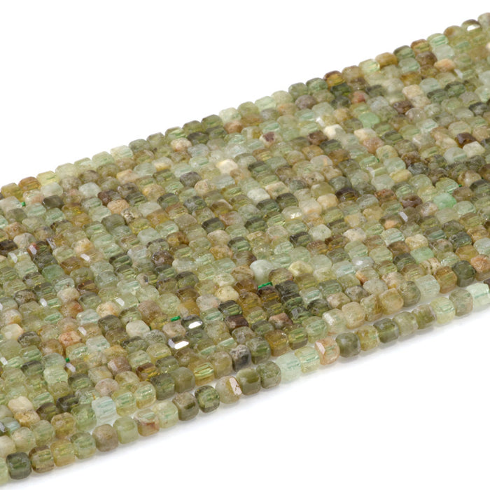 This is a Dakota Stones 3mm Green Garnet Gemstone strand with table-cut faceted cube beads in 15-16 inch strand.