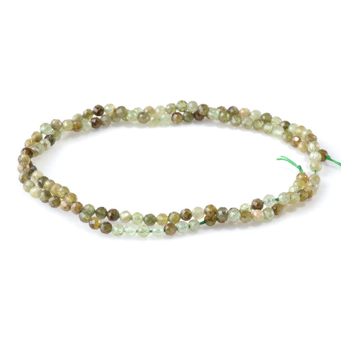 This is a Dakota Stones 3mm Green Garnet Gemstone strand with faceted round beads in 15-16 inch strand.