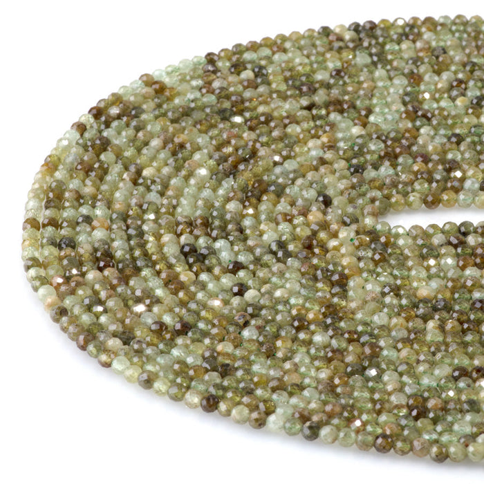 This is a Dakota Stones 3mm Green Garnet Gemstone strand with faceted round beads in 15-16 inch strand.