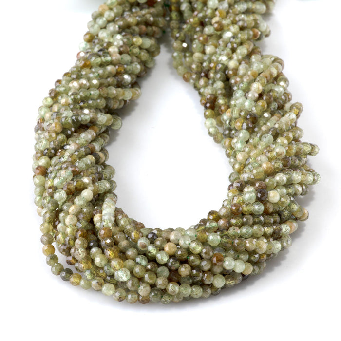 This is a Dakota Stones 3mm Green Garnet Gemstone strand with faceted round beads in 15-16 inch strand.