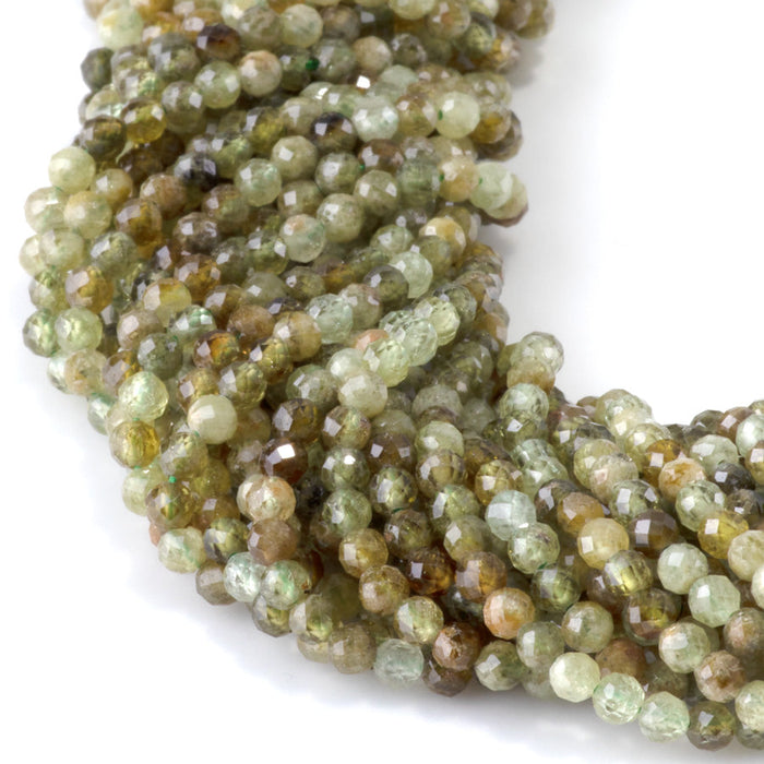 This is a Dakota Stones 3mm Green Garnet Gemstone strand with faceted round beads in 15-16 inch strand.