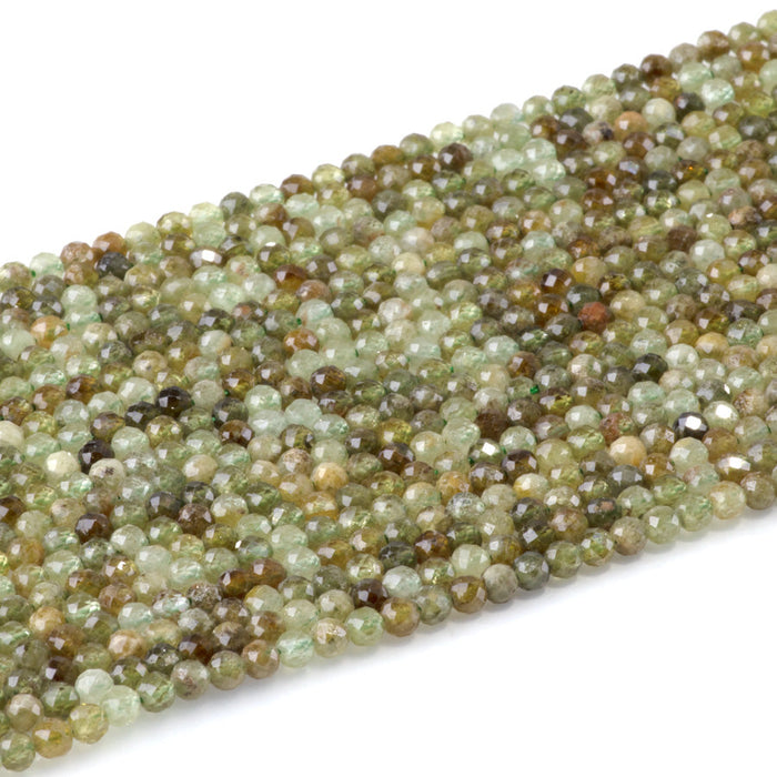 This is a Dakota Stones 3mm Green Garnet Gemstone strand with faceted round beads in 15-16 inch strand.