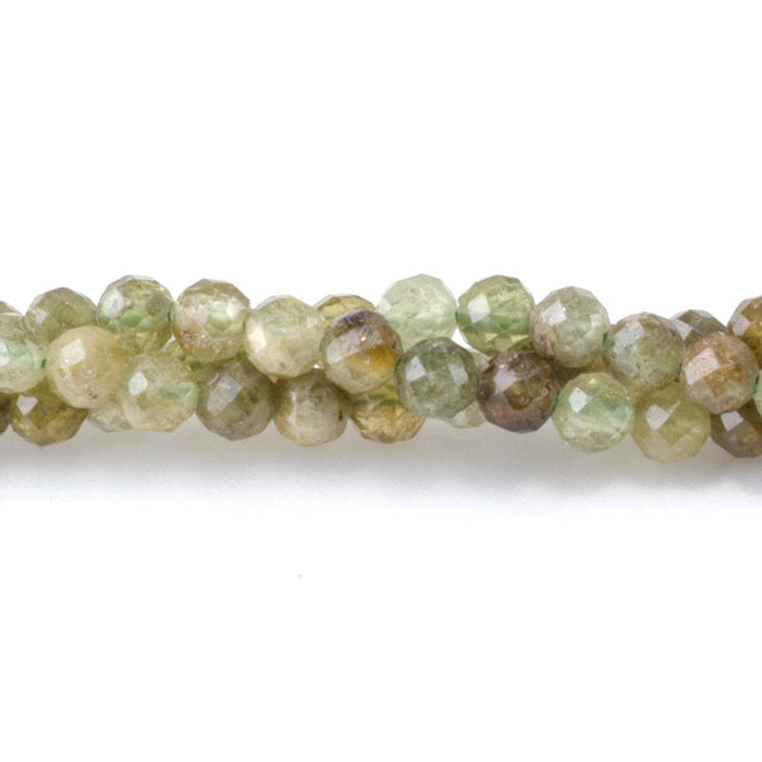 This is a Dakota Stones 3mm Green Garnet Gemstone strand with faceted round beads in 15-16 inch strand.