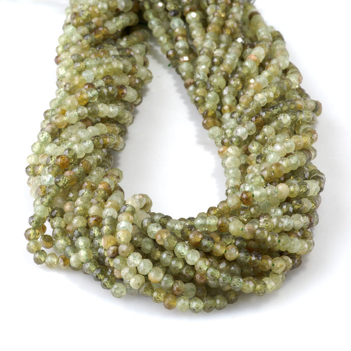 This is a Dakota Stones 3x4mm Green Garnet Gemstone strand with faceted rondelle beads in 15-16 inch strand.