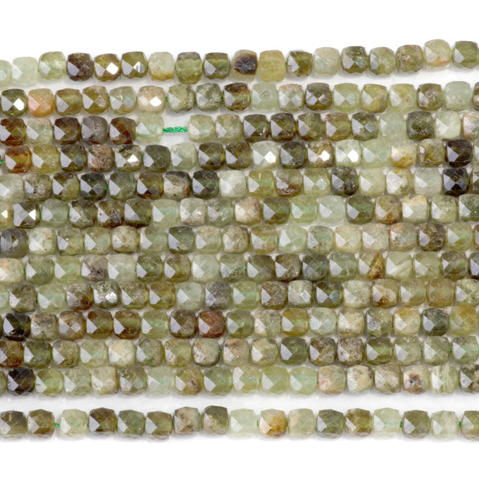 This is a Dakota Stones 4mm Green Garnet Gemstone strand with faceted cube beads in 15-16 inch strand.