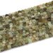 This is a Dakota Stones 4mm Green Garnet Gemstone strand with faceted cube beads in 15-16 inch strand.
