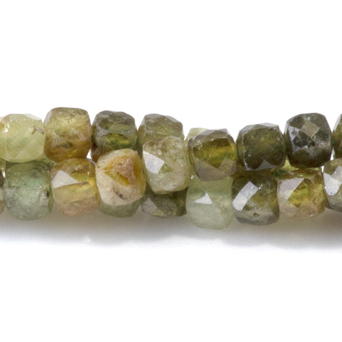 This is a Dakota Stones 4mm Green Garnet Gemstone strand with faceted cube beads in 15-16 inch strand.
