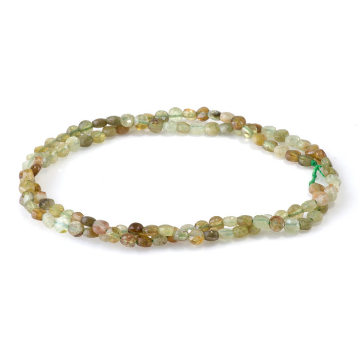 This is a Dakota Stones 4mm Green Garnet Gemstone strand with faceted coin beads in 15-16 inch strand.