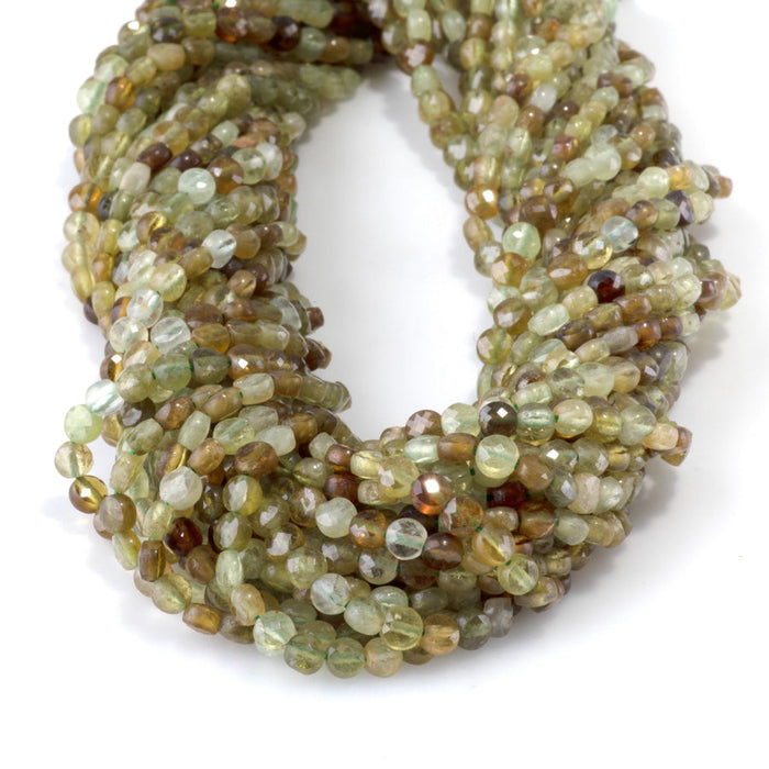 This is a Dakota Stones 4mm Green Garnet Gemstone strand with faceted coin beads in 15-16 inch strand.
