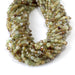 This is a Dakota Stones 4mm Green Garnet Gemstone strand with faceted coin beads in 15-16 inch strand.