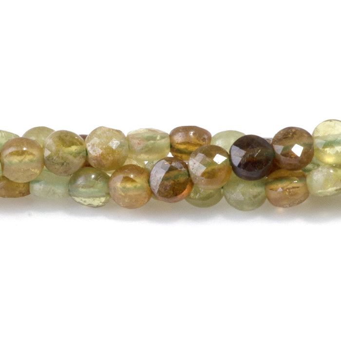 This is a Dakota Stones 4mm Green Garnet Gemstone strand with faceted coin beads in 15-16 inch strand.