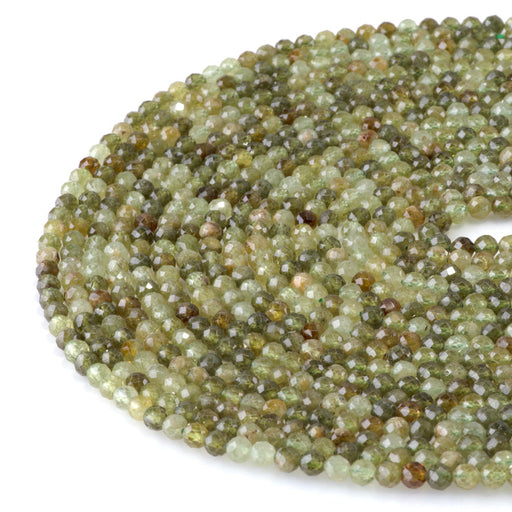 This is a Dakota Stones 4mm Green Garnet Microfaceted Gemstone strand with round beads in 15-16 inch strand.