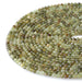 This is a Dakota Stones 4mm Green Garnet Microfaceted Gemstone strand with round beads in 15-16 inch strand.