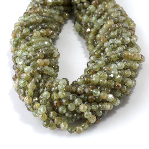 This is a Dakota Stones 4mm Green Garnet Microfaceted Gemstone strand with round beads in 15-16 inch strand.