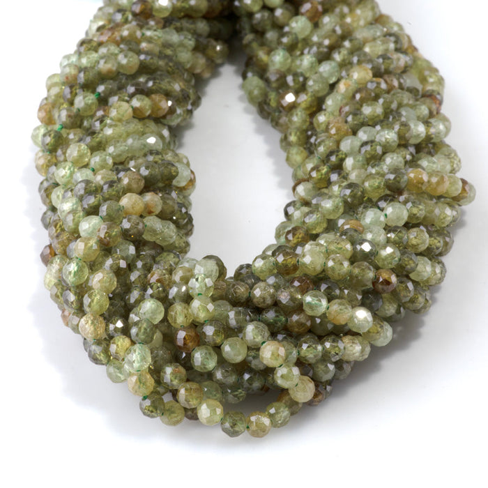 This is a Dakota Stones 4mm Green Garnet Microfaceted Gemstone strand with round beads in 15-16 inch strand.