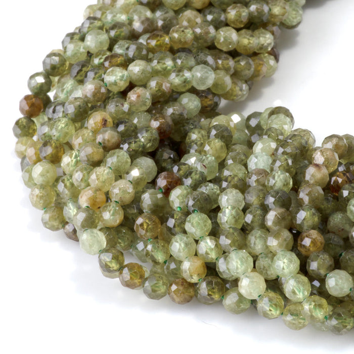 This is a Dakota Stones 4mm Green Garnet Microfaceted Gemstone strand with round beads in 15-16 inch strand.