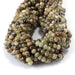 This is a Dakota Stones 4x6mm Green Garnet Gemstone strand with faceted rondelle beads in 15-16 inch strand.