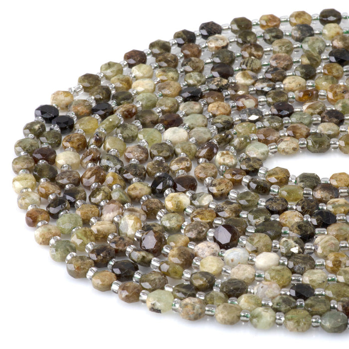 This is a Dakota Stones 6mm Green Garnet Cut Gemstone strand with coin star beads in 15-16 inch strand.