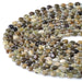 This is a Dakota Stones 6mm Green Garnet Cut Gemstone strand with coin star beads in 15-16 inch strand.