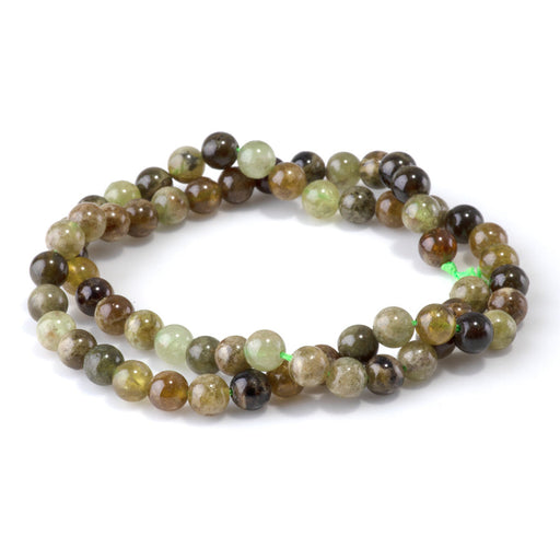 This is a Dakota Stones 6mm Green Garnet Gemstone strand with round beads in 15-16 inch strand.