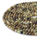 This is a Dakota Stones 6mm Green Garnet Gemstone strand with round beads in 15-16 inch strand.