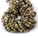 This is a Dakota Stones 6mm Green Garnet Gemstone strand with round beads in 15-16 inch strand.