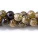 This is a Dakota Stones 6mm Green Garnet Gemstone strand with round beads in 15-16 inch strand.