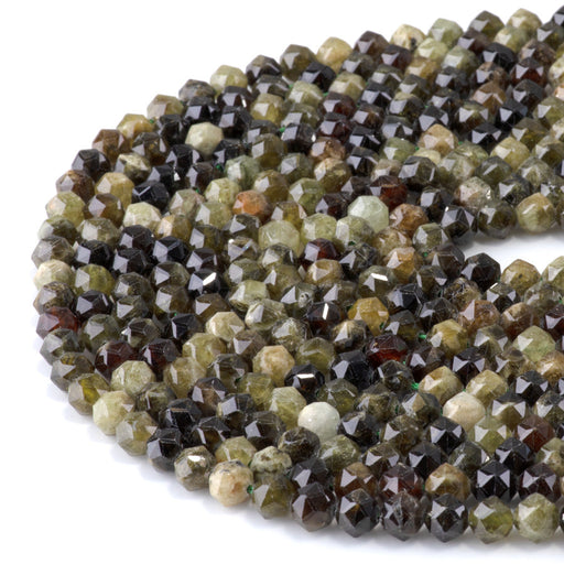 This is a Dakota Stones 6mm Green Garnet Gemstone strand with double heart faceted round beads in 15-16 inch strand.