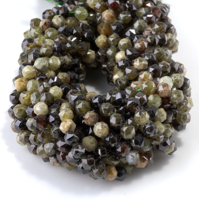 This is a Dakota Stones 6mm Green Garnet Gemstone strand with double heart faceted round beads in 15-16 inch strand.