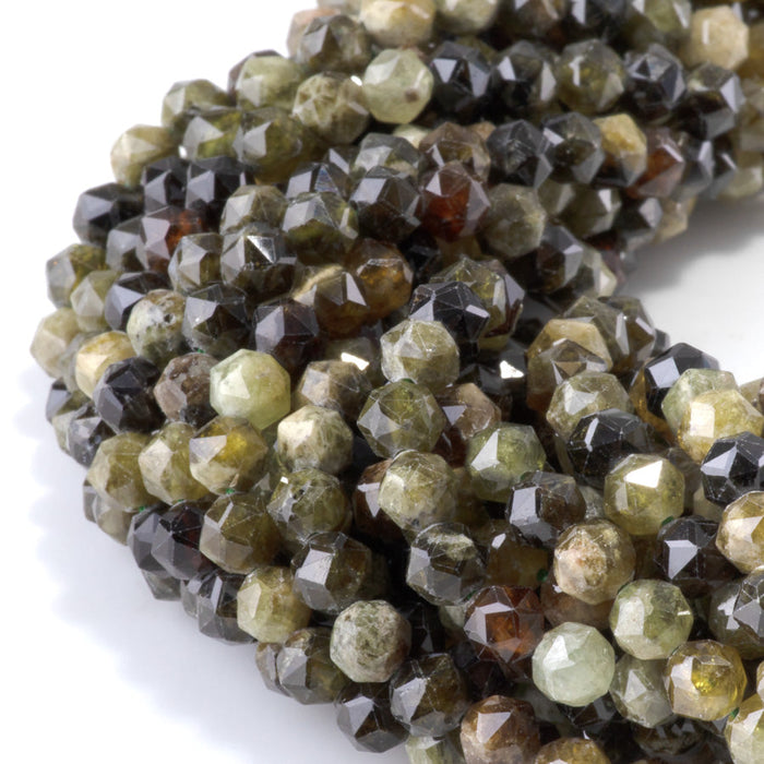 This is a Dakota Stones 6mm Green Garnet Gemstone strand with double heart faceted round beads in 15-16 inch strand.