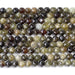 This is a Dakota Stones 6mm Green Garnet Gemstone strand with double heart faceted round beads in 15-16 inch strand.