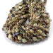 This is a Dakota Stones 8mm Green Garnet Gemstone strand with star cut faceted coin beads in 15-16 inch strand.