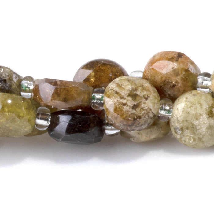 This is a Dakota Stones 8mm Green Garnet Gemstone strand with star cut faceted coin beads in 15-16 inch strand.