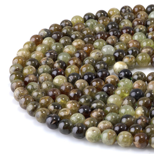 This is a Dakota Stones 8mm Green Garnet Gemstone strand with round beads in 15-16 inch strand.