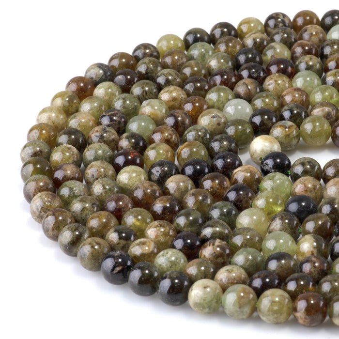 This is a Dakota Stones 8mm Green Garnet Gemstone strand with round beads in 15-16 inch strand.