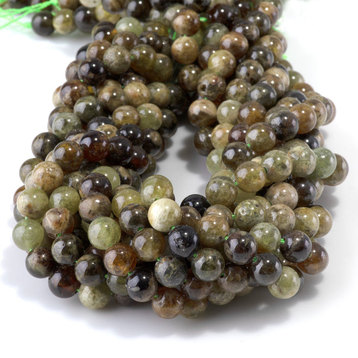 This is a Dakota Stones 8mm Green Garnet Gemstone strand with round beads in 15-16 inch strand.