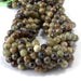 This is a Dakota Stones 8mm Green Garnet Gemstone strand with round beads in 15-16 inch strand.