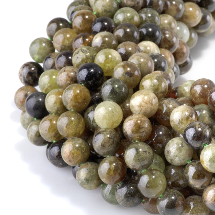 This is a Dakota Stones 8mm Green Garnet Gemstone strand with round beads in 15-16 inch strand.
