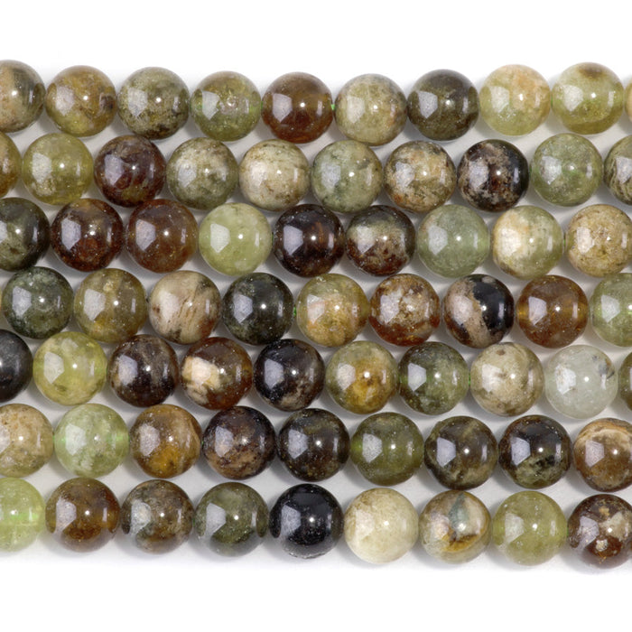 This is a Dakota Stones 8mm Green Garnet Gemstone strand with round beads in 15-16 inch strand.