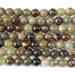 This is a Dakota Stones 8mm Green Garnet Gemstone strand with round beads in 15-16 inch strand.