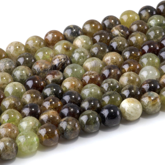 This is a Dakota Stones 8mm Green Garnet Gemstone strand with round beads in 15-16 inch strand.