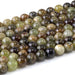 This is a Dakota Stones 8mm Green Garnet Gemstone strand with round beads in 15-16 inch strand.