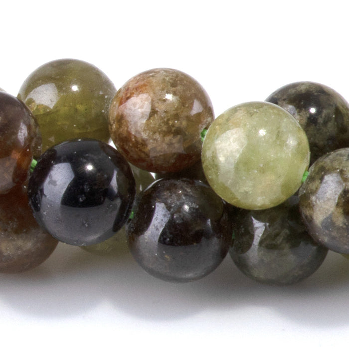 This is a Dakota Stones 8mm Green Garnet Gemstone strand with round beads in 15-16 inch strand.