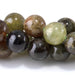 This is a Dakota Stones 8mm Green Garnet Gemstone strand with round beads in 15-16 inch strand.